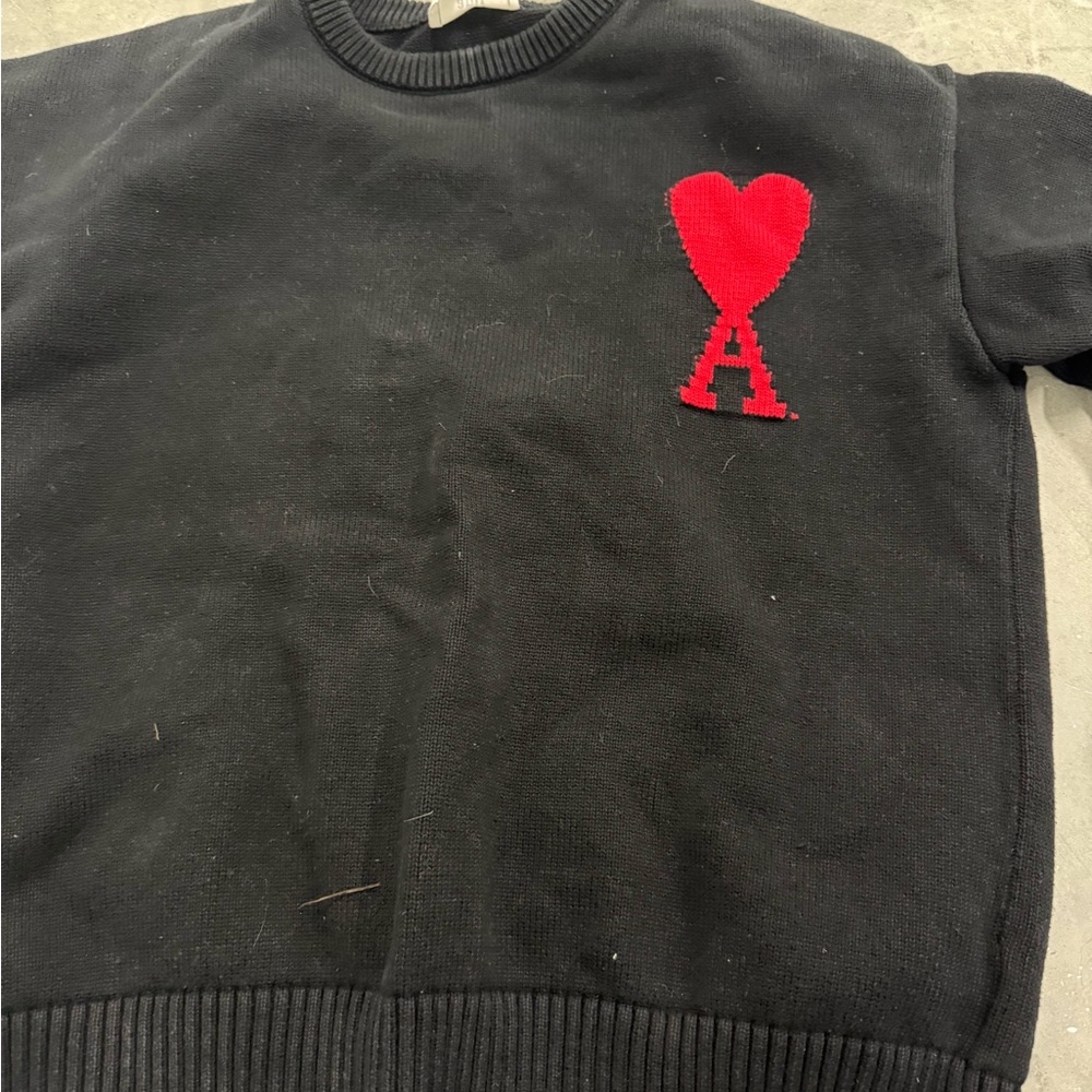 Black Sweater with Red Heart Detail